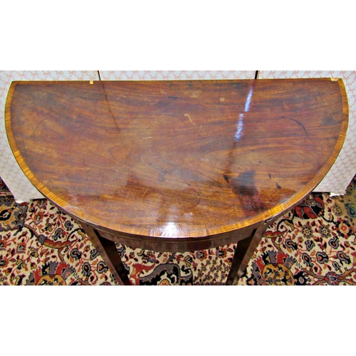 2606 - A Georgian mahogany demi lune foldover top tea table on square taper legs with inlay detail, 93cm di... 