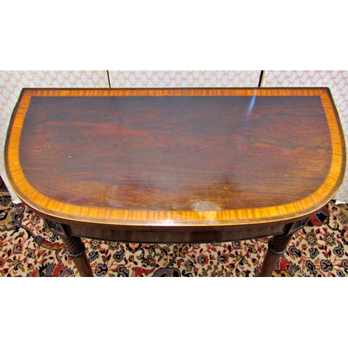 2620 - A Regency mahogany D end foldover top card table, raised on four turned and splayed supports, with a... 