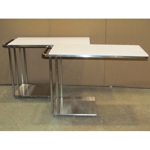 2105A - A pair of contemporary chrome cantilever tables with detachable tops