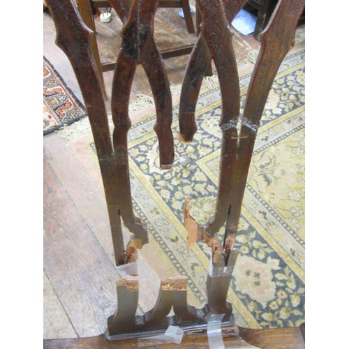 2580 - A Harlequin collection of eight Georgian mahogany dining room chairs, all with carved and pierced sp... 