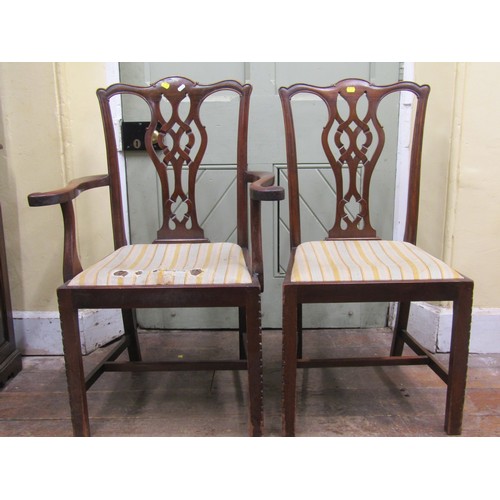 2580 - A Harlequin collection of eight Georgian mahogany dining room chairs, all with carved and pierced sp... 