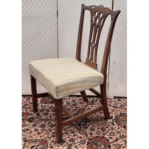 2580 - A Harlequin collection of eight Georgian mahogany dining room chairs, all with carved and pierced sp... 