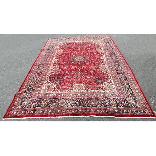 1657 - A large Country House Persian design carpet with a central medallion and an all over floral pattern ... 