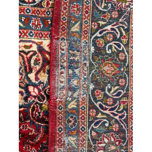 1657 - A large Country House Persian design carpet with a central medallion and an all over floral pattern ... 