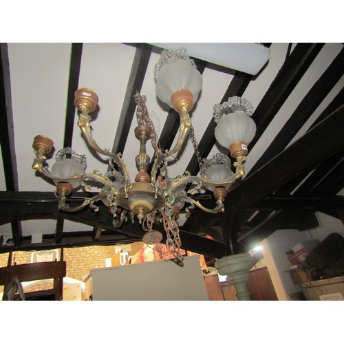 2408 - Cast gilt metal eight branch chandelier with scrolling acanthus and female mask detail, bulb fitting... 