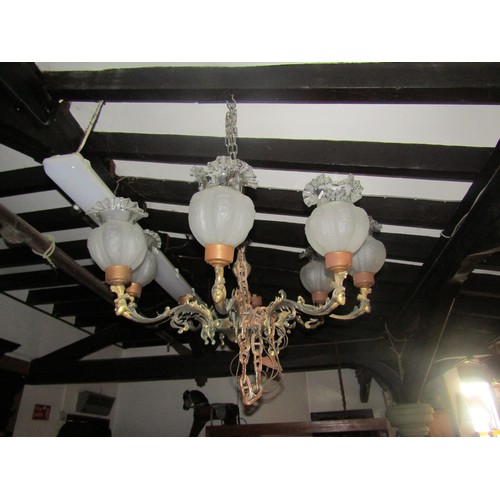 2408 - Cast gilt metal eight branch chandelier with scrolling acanthus and female mask detail, bulb fitting... 