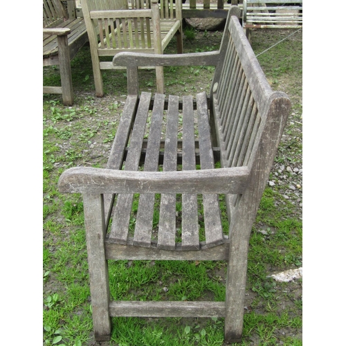 11 - A Lansdale weathered teak garden bench with slatted seat and back 150 cm wide