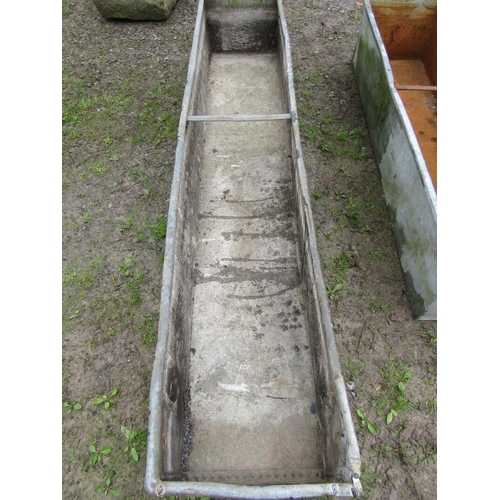24 - A vintage galvanised steel field water trough of rectangular form with pop riveted seams (af) 246 cm... 