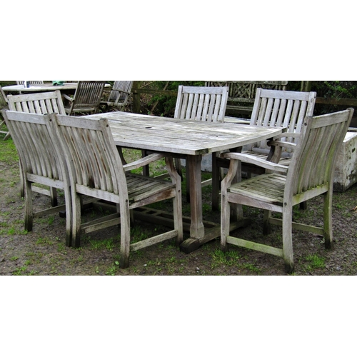 5 - A heavy gauge weathered contemporary teak rectangular garden table with shaped ends and slatted top ... 