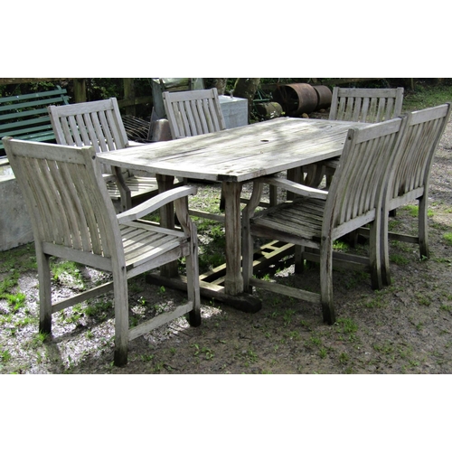 5 - A heavy gauge weathered contemporary teak rectangular garden table with shaped ends and slatted top ... 