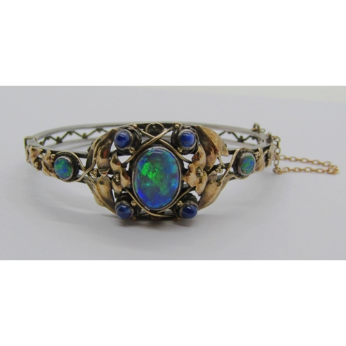 2295 - Arts & Crafts opal and sapphire hinged bangle in the manner of Rhoda Wager, in unmarked white and ye... 