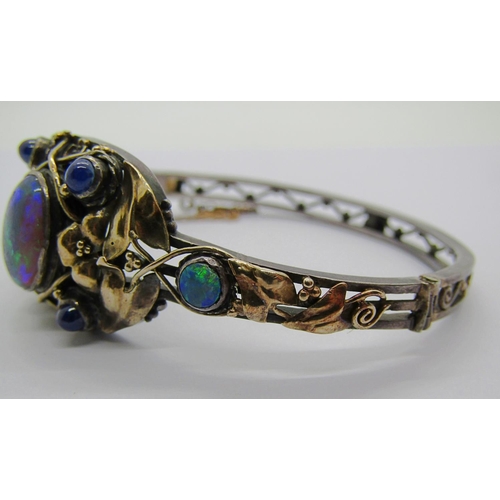 2295 - Arts & Crafts opal and sapphire hinged bangle in the manner of Rhoda Wager, in unmarked white and ye... 