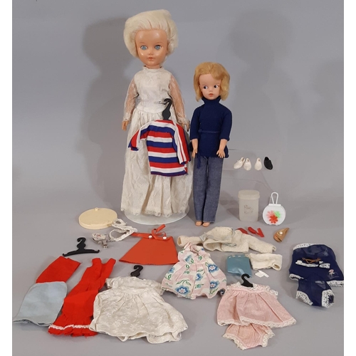 1308 - Sindy doll circa 1963 with blond hair, stamped 'Made in England' together with various Sindy clothes... 