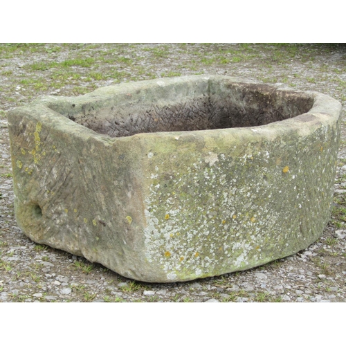 100 - A weathered bowfronted rectangular natural stone trough, 73cm wide x 57cm deep x 32cm high