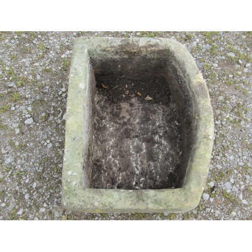 100 - A weathered bowfronted rectangular natural stone trough, 73cm wide x 57cm deep x 32cm high