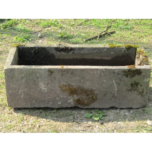 105 - A weathered rectangular natural stone trough, 93cm long x 38cm wide x 30cm high