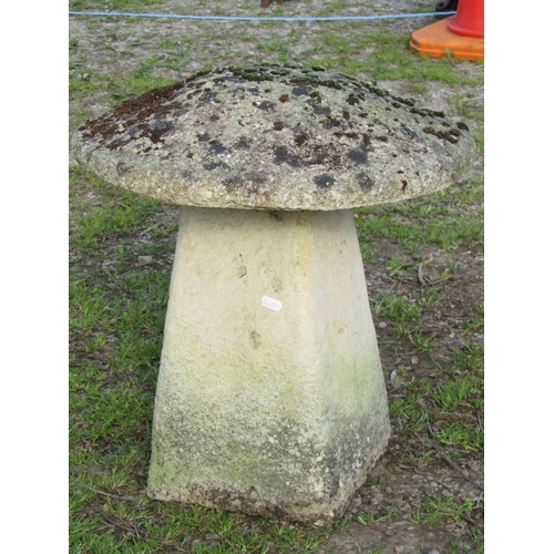 106 - A small weathered cast composition stone staddlestone and domed cap, approx 50cm diameter x approx t... 