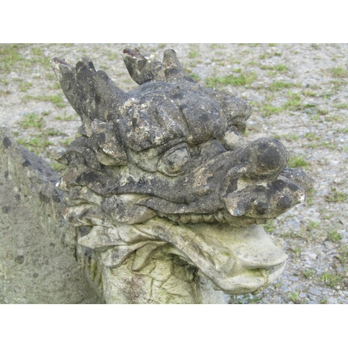 108 - A weathered cast composition stone three sectional garden ornament in the form of a dragon, the head... 