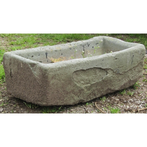 126 - A small weathered rectangular stone trough with dished interior 66 cm long x 31 cm wide x 20 cm high