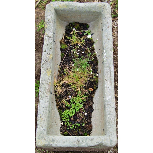 126 - A small weathered rectangular stone trough with dished interior 66 cm long x 31 cm wide x 20 cm high