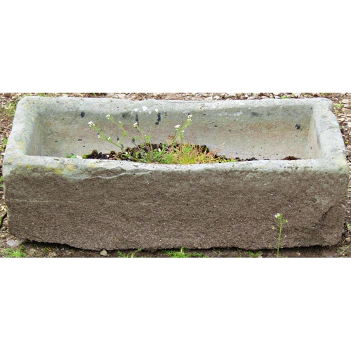 126 - A small weathered rectangular stone trough with dished interior 66 cm long x 31 cm wide x 20 cm high