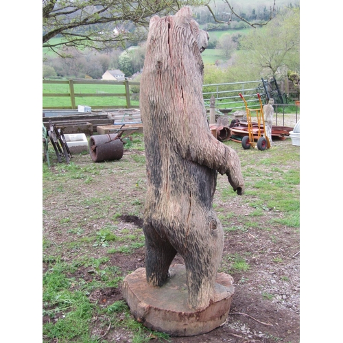 135 - A weathered forest art chainsaw carving of a standing bear with nicely defined features carved from ... 