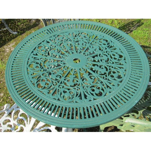 142 - A green painted cast aluminium garden terrace table with decorative circular pierced top 80 cm diame... 