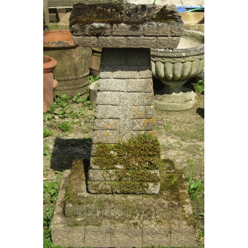 145 - A large weathered mock stone wall effect three sectional bird bath, the square top 45 cm raised on a... 