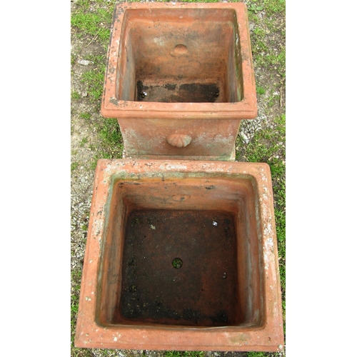 146 - A pair of weathered terracotta planters of square cut and moulded form, approximately 50 cm square x... 