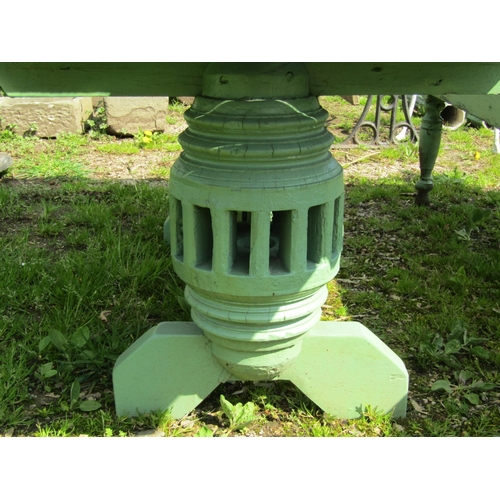 154 - A weathered light green painted rustic garden table, the overhanging rectangular slatted panelled to... 