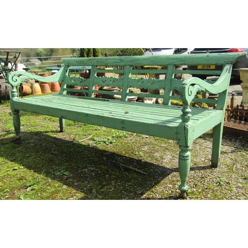 154 - A weathered light green painted rustic garden table, the overhanging rectangular slatted panelled to... 