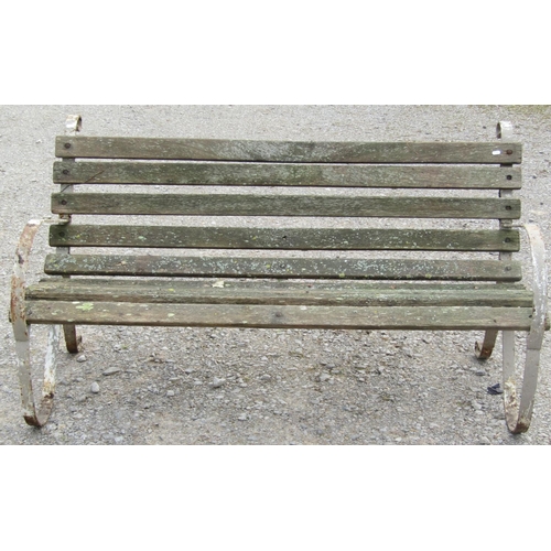 157 - A vintage weathered sprung steel garden bench with wooden lathes, 153 cm (5ft wide) together with a ... 