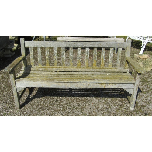 161 - A vintage weathered teak three seat garden bench with slatted seat and back probably a Lister exampl... 