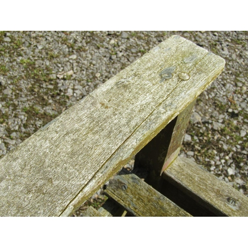 161 - A vintage weathered teak three seat garden bench with slatted seat and back probably a Lister exampl... 