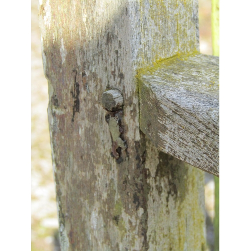 161 - A vintage weathered teak three seat garden bench with slatted seat and back probably a Lister exampl... 