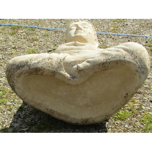 164 - A large mock stone effect (moulded fibreglass) garden ornament in the form of a seated cross legged ... 