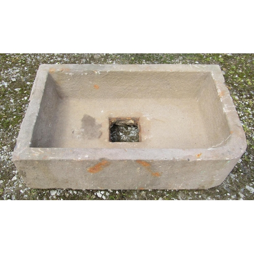 167 - A weathered rectangular natural stone trough with single rounded corner and central square drain 74 ... 