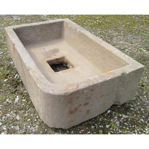 167 - A weathered rectangular natural stone trough with single rounded corner and central square drain 74 ... 