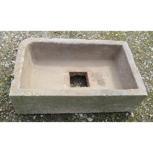 167 - A weathered rectangular natural stone trough with single rounded corner and central square drain 74 ... 