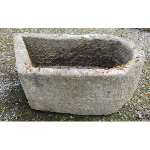 168 - An unusual weathered carved natural stone rectangular D end and canted stone trough with circular dr... 