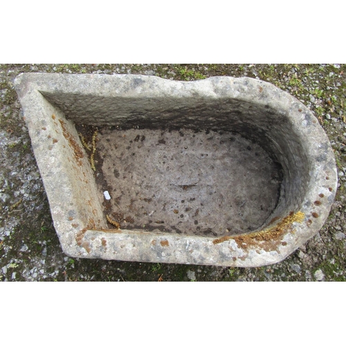 168 - An unusual weathered carved natural stone rectangular D end and canted stone trough with circular dr... 