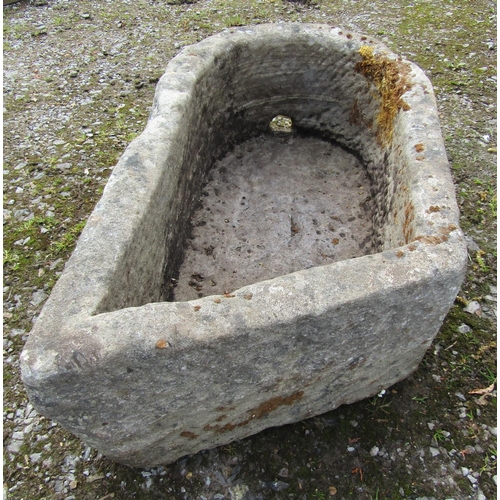 168 - An unusual weathered carved natural stone rectangular D end and canted stone trough with circular dr... 