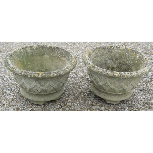 171 - A pair of weathered cast composition stone squat circular tapered garden urns with lattice detail, 4... 