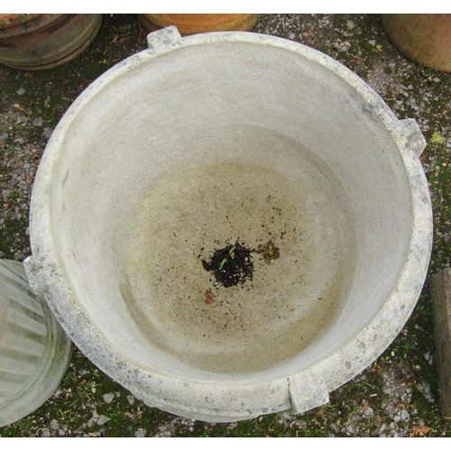 179 - A pair of weathered cast composition stone garden urns, the circular waisted bowls with Greek key, r... 