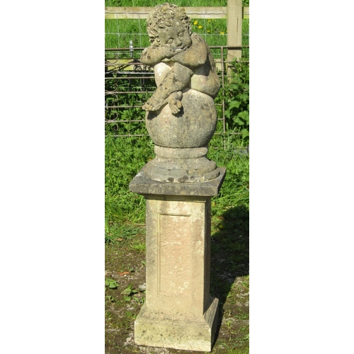 182 - A nicely weathered cast composition stone garden ornament in the form of a sleeping cross legged che... 