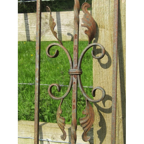 186 - A heavy gauge ironwork arched pedestrian side gate with raised finials and simple scroll detail, 92 ... 