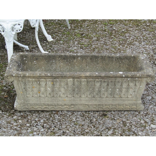 191 - A weathered cast composition stone rectangular flower trough with scrolled ends and repeating relief... 