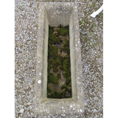 191 - A weathered cast composition stone rectangular flower trough with scrolled ends and repeating relief... 