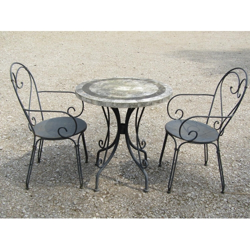 192 - A weathered heavy gauge steel three piece garden terrace/bistro set, the table with circular composi... 