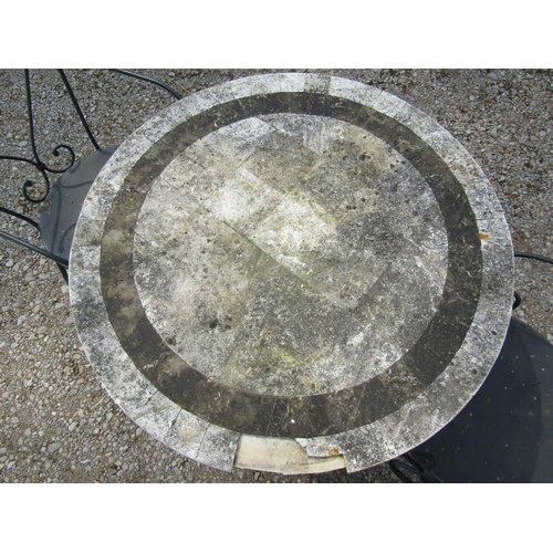 192 - A weathered heavy gauge steel three piece garden terrace/bistro set, the table with circular composi... 